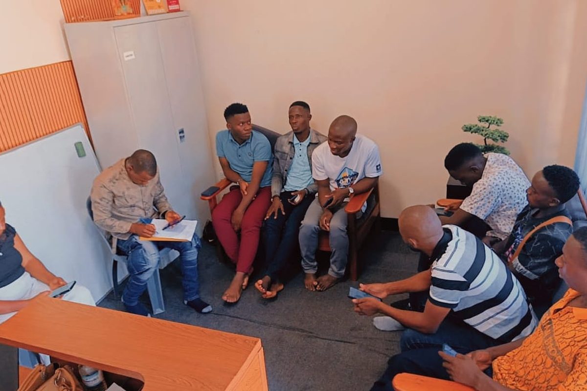 Onboarding of a first cohort of young men in a hub office in Kampala